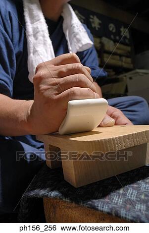 Close-up of a carpenter planing the surface on a wooden structure View Large Photo Image Stock Photograph - Close-up of a carpenter planing the surface on a wooden structure. Fotosearch