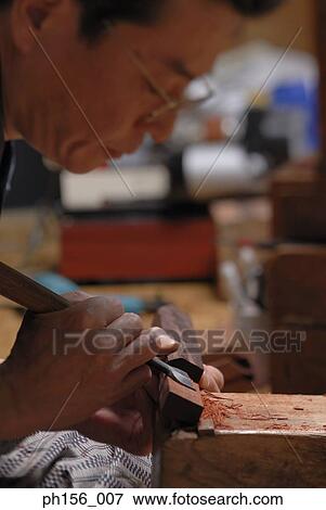Close-up of a carpenter working with a chisel View Large Photo Image Stock Photo - Close-up of a carpenter working with a chisel. Fotosearch