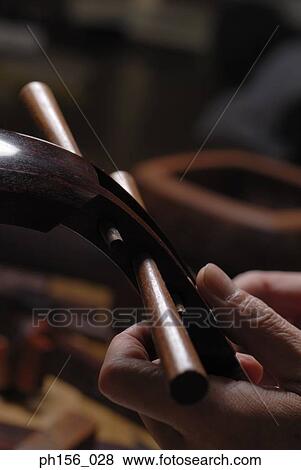Close-up of a carpenter's hand making a samisen View Large Photo Image Stock Photo - Close-up of a carpenter's hand making a samisen. Fotosearch