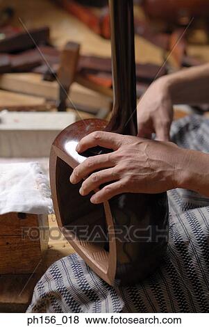 Close-up of a carpenter's hand making samisen View Large Photo Image Stock Photo - Close-up of a carpenter's hand making samisen. Fotosearch