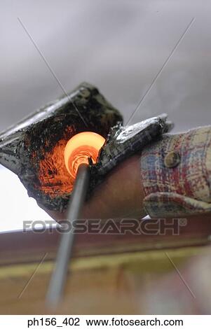 Close-up of a glass bulb being molded View Large Photo Image Stock Image - Close-up of a glass bulb being molded. Fotosearch
