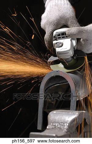 Close-up of a grinder working in a workshop View Large Photo Image Stock Photo - Close-up of a grinder working in a workshop. Fotosearch