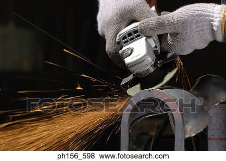 Close-up of a grinder working in a workshop View Large Photo Image Stock Photo - Close-up of a grinder working in a workshop. Fotosearch
