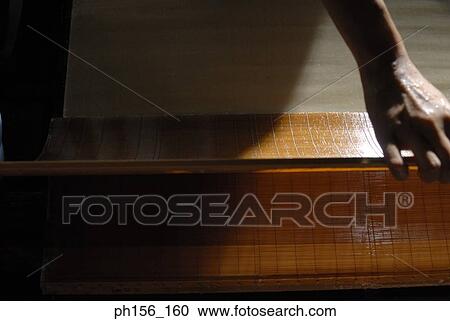 Close-up of a human hand and a wooden mat View Large Photo Image Stock Image - Close-up of a human hand and a wooden mat. Fotosearch