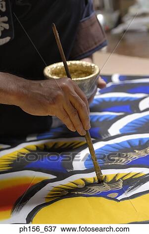 Close-up of a painter's hand painting View Large Photo Image Stock Photo - Close-up of a painter's hand painting. Fotosearch