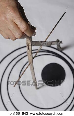 Close-up of a painter's hand using a growing compass View Large Photo Image Stock Image - Close-up of a painter's hand using a growing compass. Fotosearch