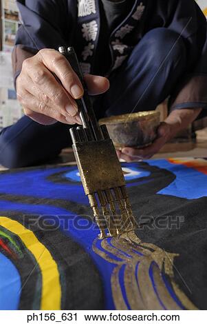 Close-up of a painter's hands painting on a sheet View Large Photo Image Stock Image - Close-up of a painter's hands painting on a sheet. Fotosearch