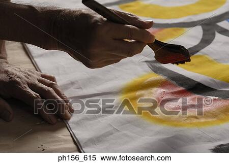 Close-up of a painter's hands painting on a sheet View Large Photo Image Stock Photography - Close-up of a painter's hands painting on a sheet. Fotosearch