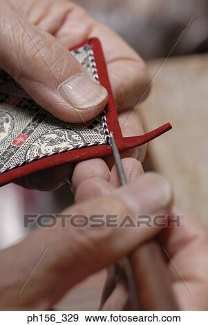 Close-up of a person's fingers using a tool View Large Photo Image Stock Photo - Close-up of a person's fingers using a tool. Fotosearch