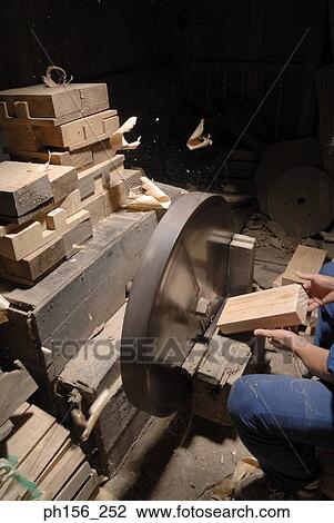 Close-up of a person's hand cutting wood in a workshop View Large Photo Image Stock Image - Close-up of a person's hand cutting wood in a workshop. Fotosearch