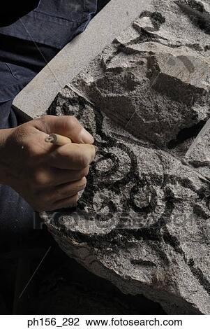 Close-up of a person's hand drawing on stone View Large Photo Image Stock Image - Close-up of a person's hand drawing on stone. Fotosearch