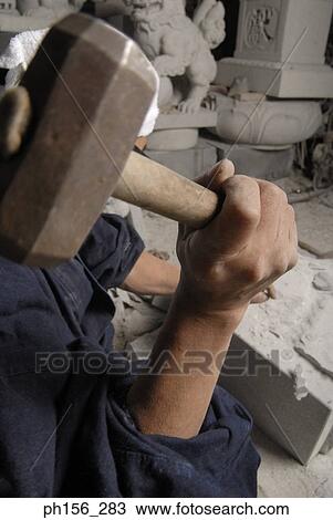 Close-up of a person's hand holding a hammer View Large Photo Image Stock Image - Close-up of a person's hand holding a hammer. Fotosearch