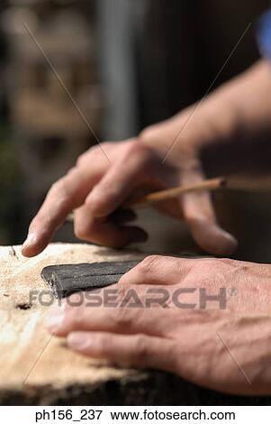Close-up of a person's hand holding a pencil View Large Photo Image Stock Photo - Close-up of a person's hand holding a pencil. Fotosearch
