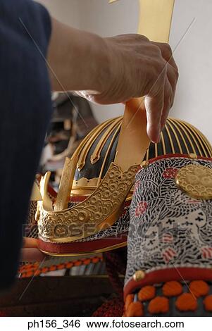 Close-up of a person's hand making a suit of armor View Large Photo Image Stock Photograph - Close-up of a person's hand making a suit of armor. Fotosearch
