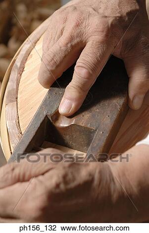 Close-up of a person's hand planing wood View Large Photo Image Stock Image - Close-up of a person's hand planing wood. Fotosearch