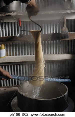 Close-up of a person's hand squeezing silk threads View Large Photo Image Stock Image - Close-up of a person's hand squeezing silk threads. Fotosearch