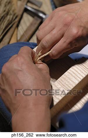 Close-up of a person's hand tying a rope View Large Photo Image Stock Image - Close-up of a person's hand tying a rope. Fotosearch