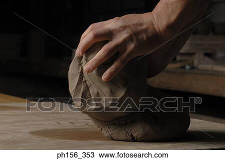 Close-up of a person's hands kneading mud View Large Photo Image Stock Image - Close-up of a person's hands kneading mud. Fotosearch