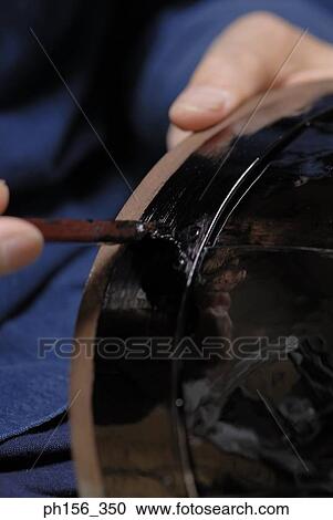 Close-up of a person's hands making a helmet of armor View Large Photo Image Stock Image - Close-up of a person's hands making a helmet of armor. Fotosearch