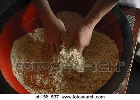 Close-up of a person's hands mixing flour in a mixing bowl View Large Photo Image Stock Photo - Close-up of a person's hands mixing flour in a mixing bowl. Fotosearch