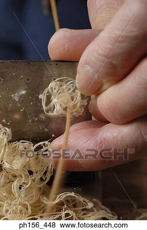 Close-up of a person's hands shaving wood View Large Photo Image Stock Photo - Close-up of a person's hands shaving wood. Fotosearch