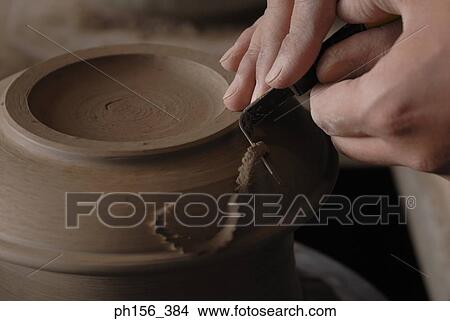 Close-up of a potter's hands making a vase on a pottery wheel View Large Photo Image Picture - Close-up of a potter's hands making a vase on a pottery wheel. Fotosearch
