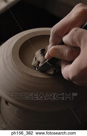Close-up of a potter's hands making a vase on a pottery wheel View Large Photo Image Stock Image - Close-up of a potter's hands making a vase on a pottery wheel. Fotosearch