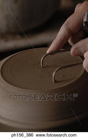 Close-up of a potter's hands making a vase on a pottery wheel View Large Photo Image Stock Photograph - Close-up of a potter's hands making a vase on a pottery wheel. Fotosearch