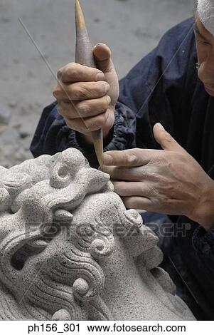 Close-up of a sculptor carving a statue with a chisel View Large Photo Image Stock Image - Close-up of a sculptor carving a statue with a chisel. Fotosearch