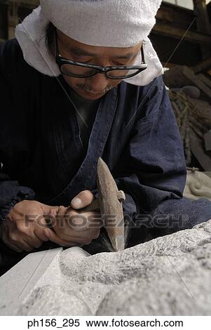 Close-up of a sculptor carving a stone View Large Photo Image Stock Photography - Close-up of a sculptor carving a stone. Fotosearch