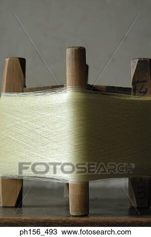 Close-up of a spool of silk thread View Large Photo Image Stock Image - Close-up of a spool of silk thread. Fotosearch