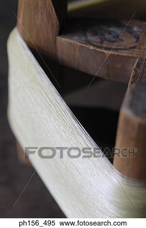 Close-up of a spool of silk thread View Large Photo Image Stock Photography - Close-up of a spool of silk thread. Fotosearch
