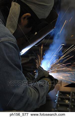 Close-up of a welder welding View Large Photo Image Stock Photo - Close-up of a welder welding. Fotosearch