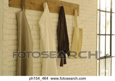 Close-up of clothes and bags hanging on a hanger View Large Photo Image Picture - Close-up of clothes and bags hanging on a hanger. Fotosearch