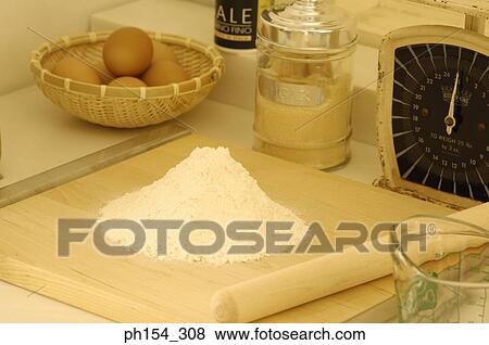 Close-up of flour with a cutting board on a weighing scale View Large Photo Image Stock Photo - Close-up of flour with a cutting board on a weighing scale. Fotosearch