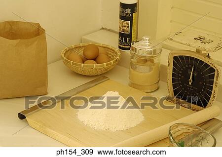 Close-up of flour with a cutting board on a weighing scale View Large Photo Image Stock Photo - Close-up of flour with a cutting board on a weighing scale. Fotosearch