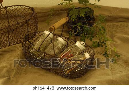Close-up of jars of spices in a basket View Large Photo Image Stock Image - Close-up of jars of spices in a basket. Fotosearch