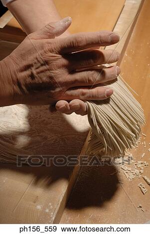 Close-up of person's hands holding noodles View Large Photo Image Stock Photo - Close-up of person's hands holding noodles. Fotosearch