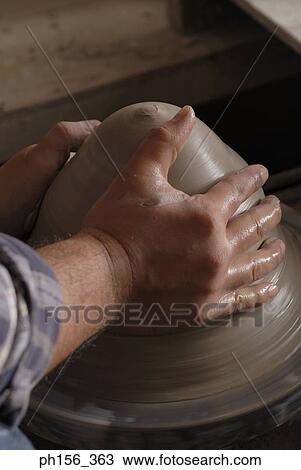 Close-up of person's hands making pottery View Large Photo Image Stock Image - Close-up of person's hands making pottery. Fotosearch