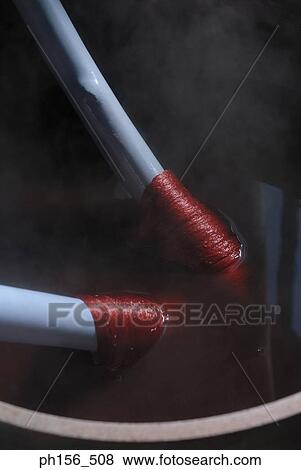 Close-up of silk threads on sticks in hot water View Large Photo Image Stock Photo - Close-up of silk threads on sticks in hot water. Fotosearch