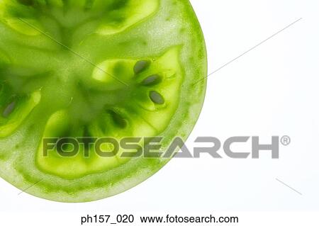 Cross-section of green tomatoe View Large Photo Image Stock Image - Cross-section of green tomatoe. Fotosearch