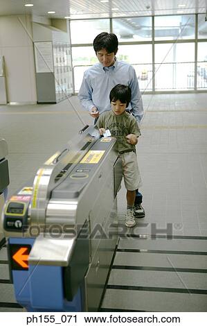 Father and his son at a subway station View Large Photo Image Stock Image - Father and his son at a subway station. Fotosearch