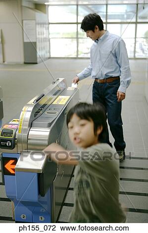 Father and his son at a subway station View Large Photo Image Stock Image - Father and his son at a subway station. Fotosearch