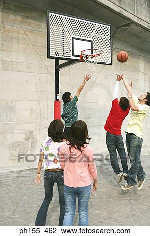 Five people playing basketball View Large Photo Image Stock Image - Five people playing basketball. Fotosearch