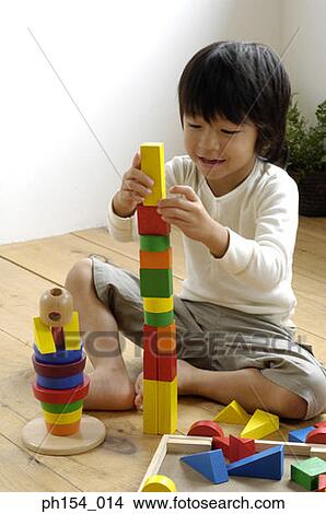 Picture - Girl playing with blocks. Fotosearch
