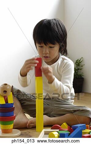 Girl playing with blocks View Large Photo Image Stock Image - Girl playing with blocks. Fotosearch