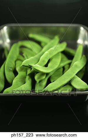 Stock Image - Green beans in a tray. Fotosearch
