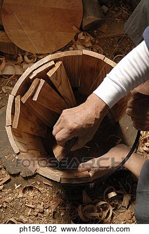 High angle view of a carpenter making a barrel View Large Photo Image Stock Image - High angle view of a carpenter making a barrel. Fotosearch