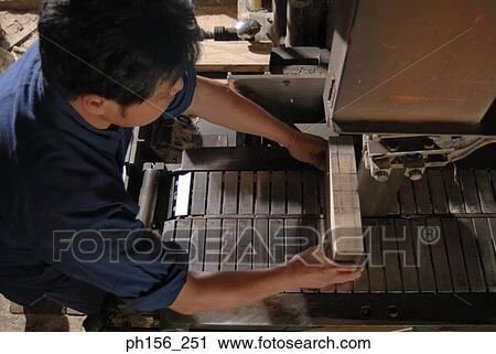 High angle view of a carpenter working in a workshop View Large Photo Image Stock Image - High angle view of a carpenter working in a workshop. Fotosearch