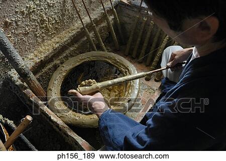 High angle view of a man making candles in a factory View Large Photo Image Stock Photo - High angle view of a man making candles in a factory. Fotosearch